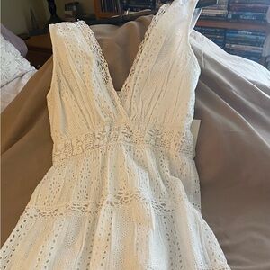 White lace dress. Never worn beautiful with some elastic stretch in the back.
